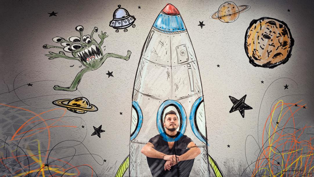 Man in a drawing of a rocket surrounded by stars, planets and aliens – deprived students college partnerships scholarships