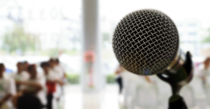 Microphone in front of a crowd; debates and speeches resources