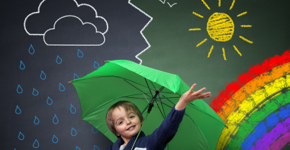 Primary Pupil Holding An Umbrella Standing In Front Of Different Types Of Weather