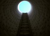 Ladder leading out of a deep hole, towards a circle of light
